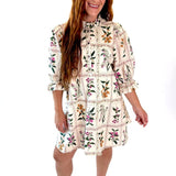 Woman wearing a floral dress on a white background