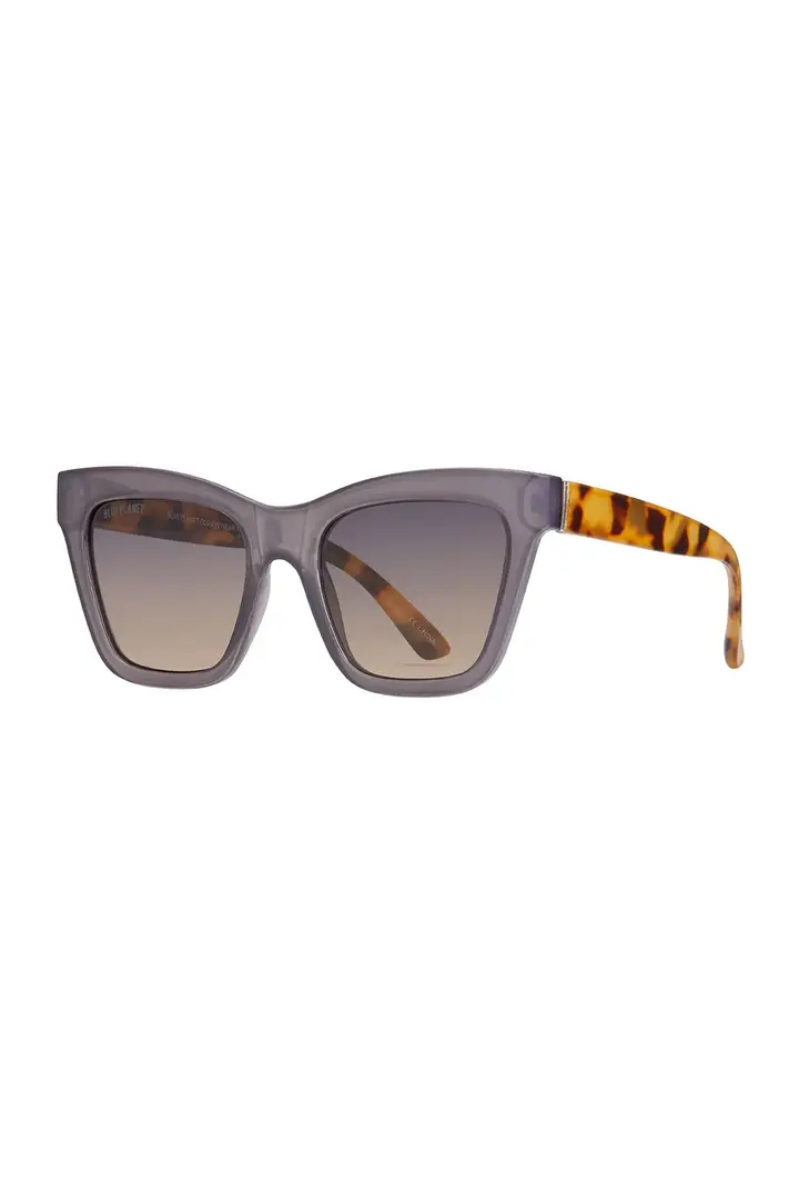 Sunglasses with gray frame and tortoiseshell accents on a white background