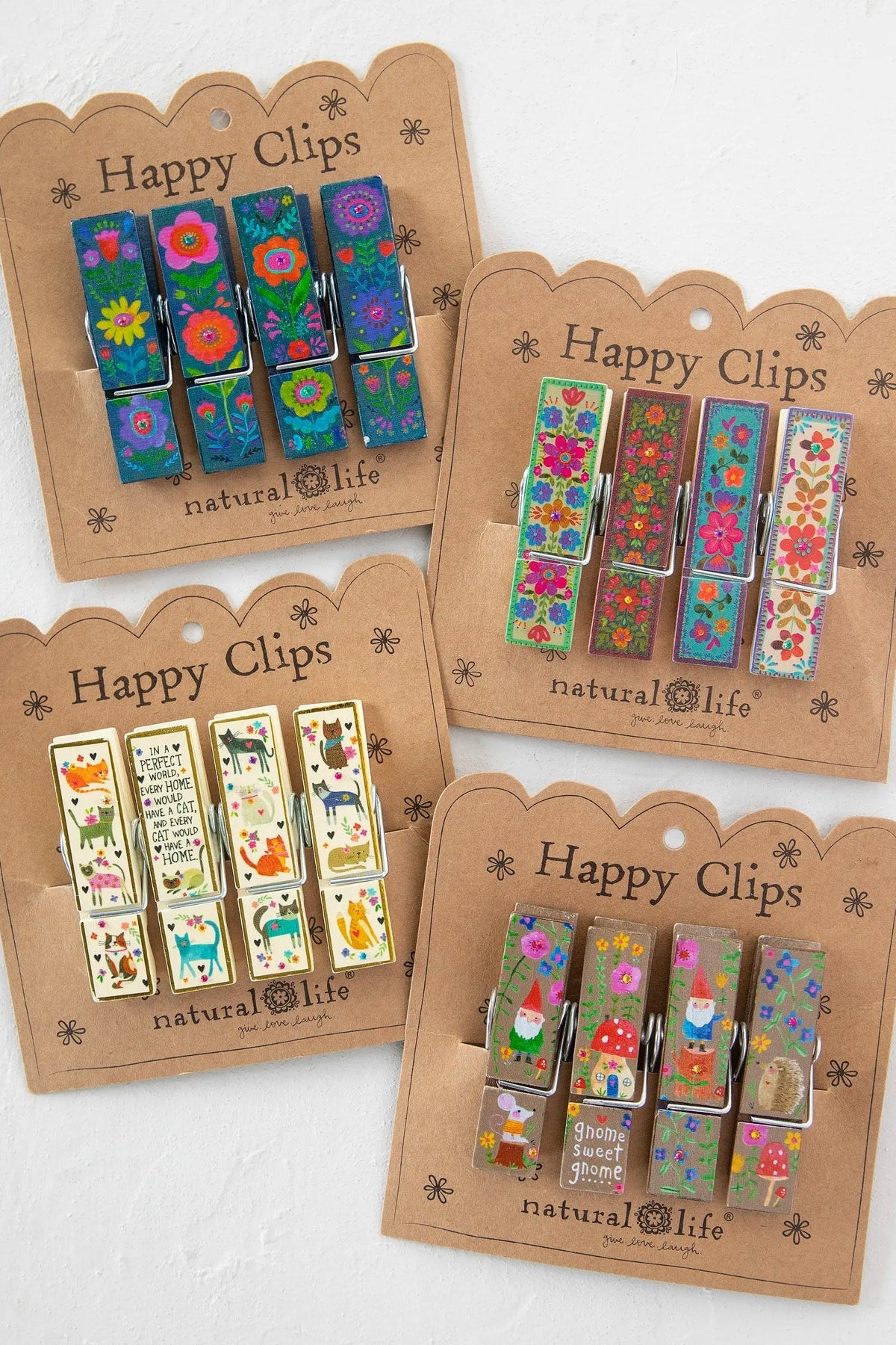 Set of Happy Clips with colorful designs on brown packaging