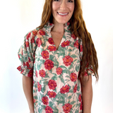 Woman wearing a floral blouse with a white background