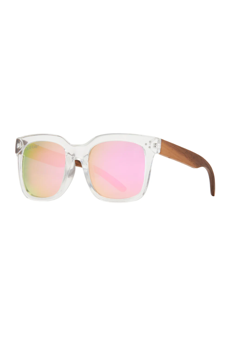 Sunglasses with pink reflective lenses and wooden arms on a white background