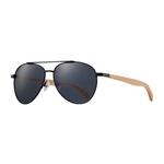 Sunglasses with dark lenses and wooden arms on a white background