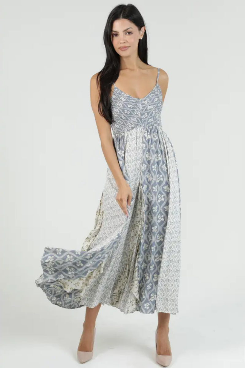 Woman wearing a floral patterned dress on a white background