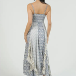 Woman wearing a floral dress with a white background