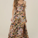 Woman wearing a floral dress on a plain background | Floral Tie Bust Maxi Dress with Side Slit