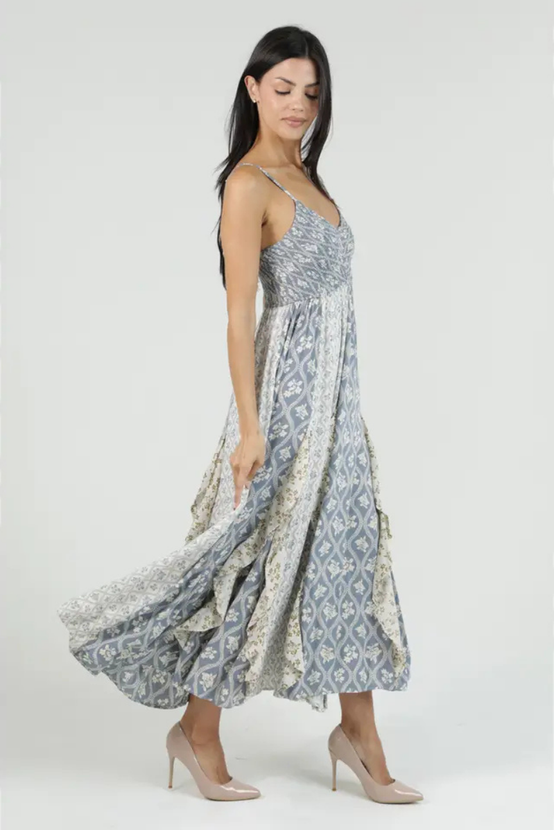 Woman wearing a floral patterned dress on a white background
