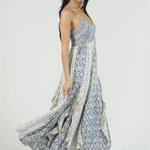 Woman wearing a floral patterned dress on a white background
