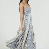 Woman wearing a floral patterned dress on a white background
