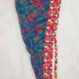 Colorful floral-patterned leggings on a light background