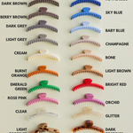 Collection of hair clips in various colors on a white background. Shiny Midi Hold Everything Claw | KAXI