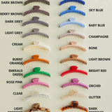 Collection of hair clips in various colors on a white background. Shiny Midi Hold Everything Claw | KAXI