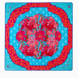 Colorful Tile/Game mat in a floral design on a blue background with red border. Delilah Mat in Tube | Oh My Mahjong