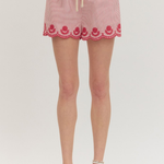 Red Stripe seersucker shorts with lace trim on a white background