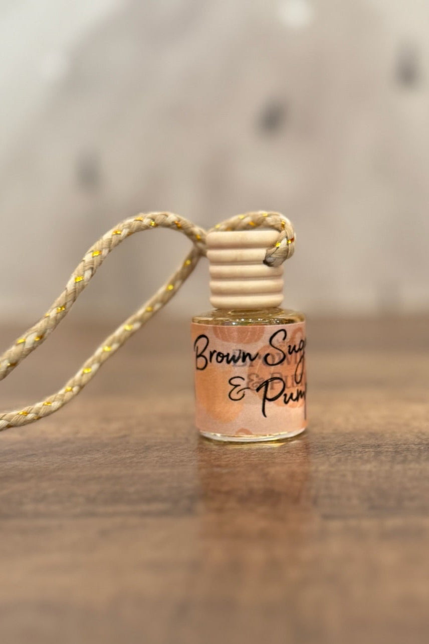Small bottle with a string on a wooden surface