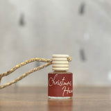 Small bottle with a wooden cap and string on a wooden surface with a blurred background