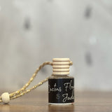 Small bottle with a wooden cap on a wooden surface, blurred background