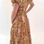 Woman wearing a floral dress on a white background