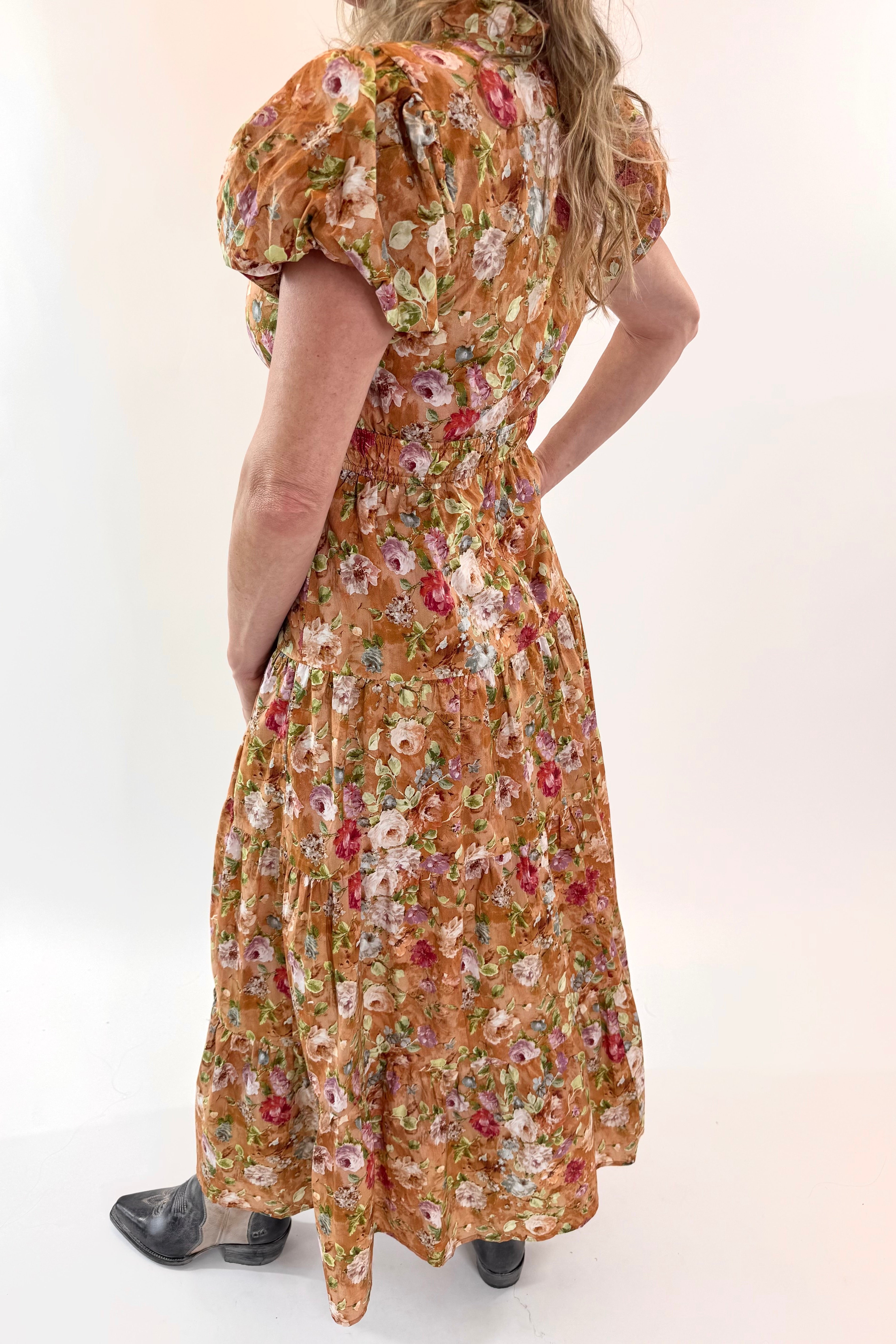 Woman wearing a floral dress on a white background