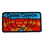 Embroidered patch of the Grand Canyon with red and blue design on a black background