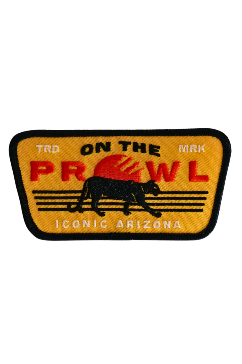 Patch with 'On the Prowl' text and a panther design on a yellow background