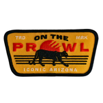 Patch with 'On the Prowl' text and a panther design on a yellow background