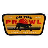 Patch with 'On the Prowl' text and a panther design on a yellow background
