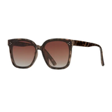 Sunglasses with brown gradient lenses and tortoiseshell frame on a white background