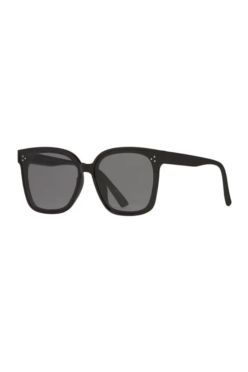 Black sunglasses with dark lenses on a white background
