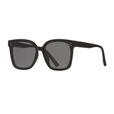 Black sunglasses with dark lenses on a white background