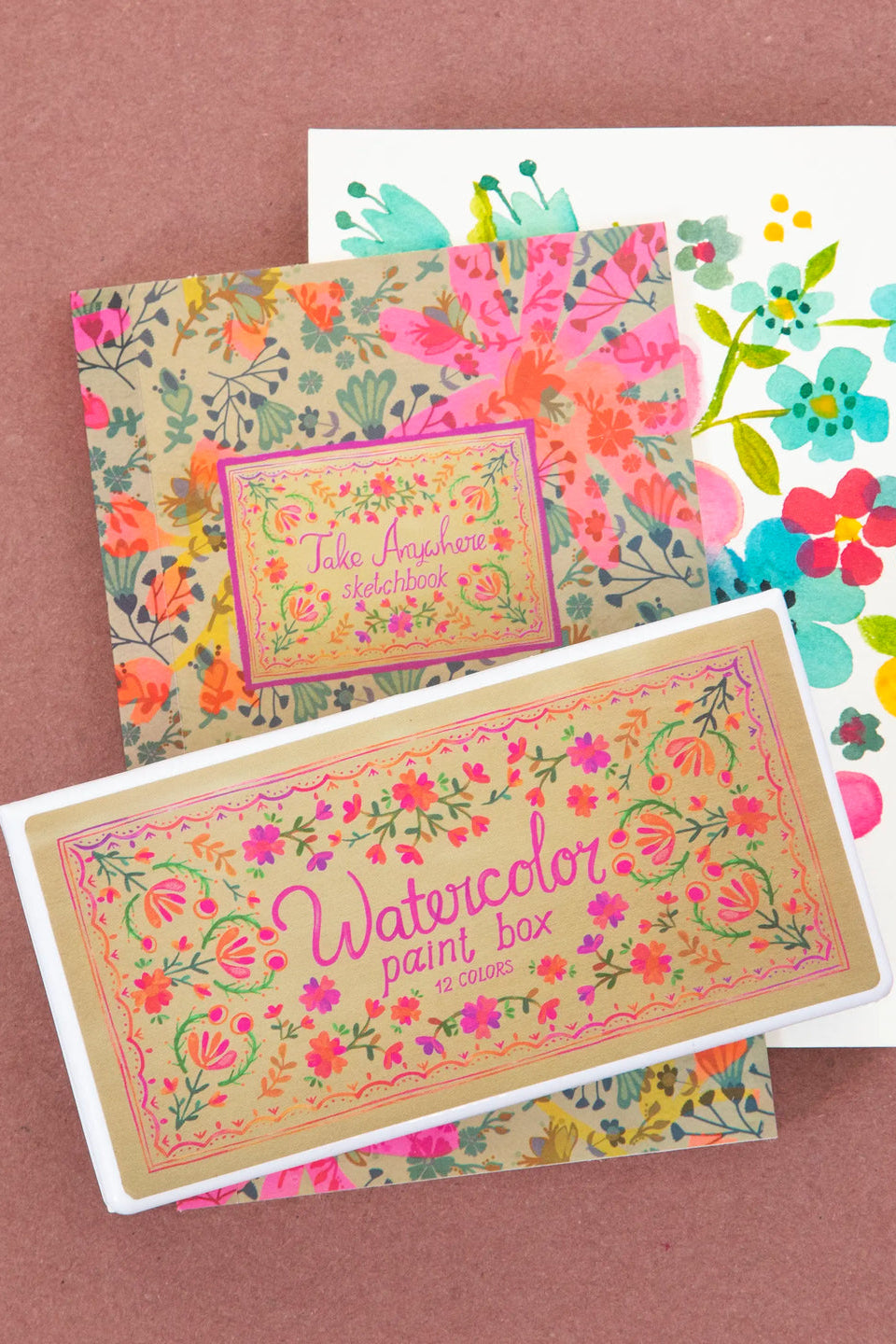 Floral-themed greeting cards on a pink background