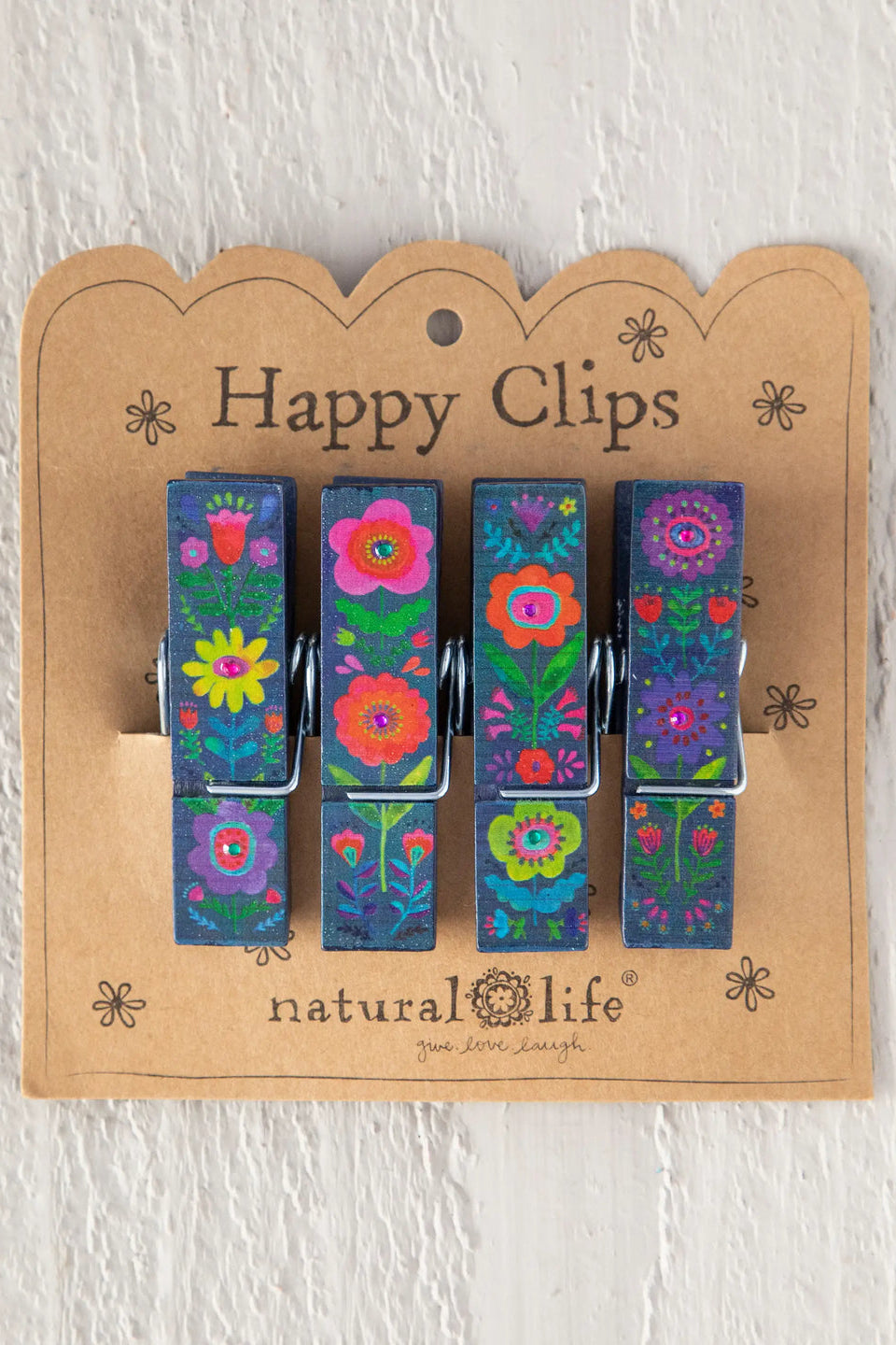 Set of colorful floral clips on a 'Happy Clips' card with 'natural life' branding.