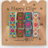 Happy Clips packaging with colorful floral designs on a white background