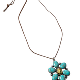 Necklace with a turquoise flower pendant on a white background