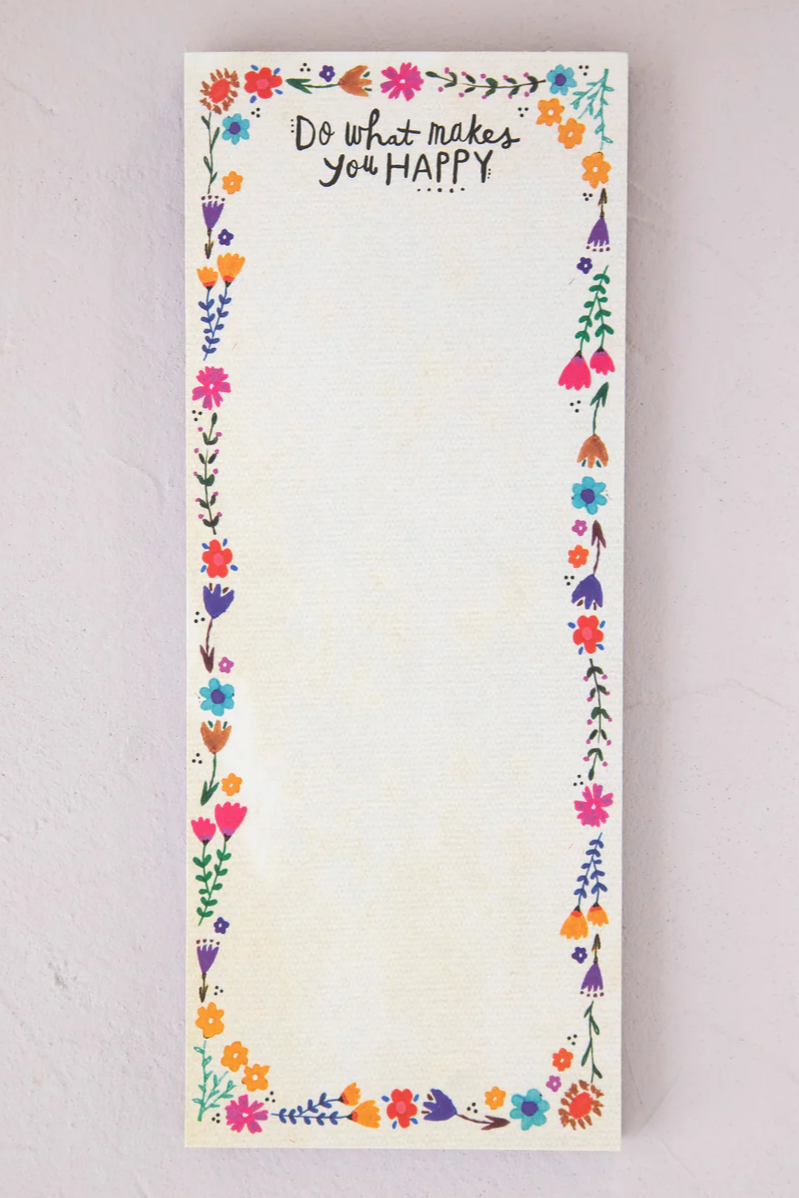Notepad with floral border and motivational quote on a light background