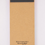 Kraft paper package with a black magnet on a white background