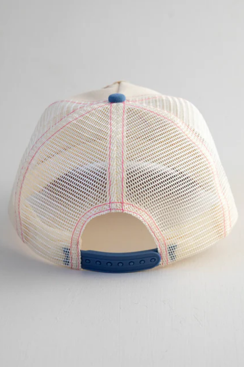 Back view of a beige mesh cap with blue accents on a light gray background