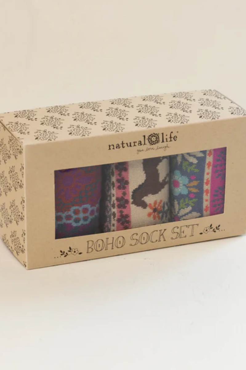 Box of boho sock set with visible design on a beige background