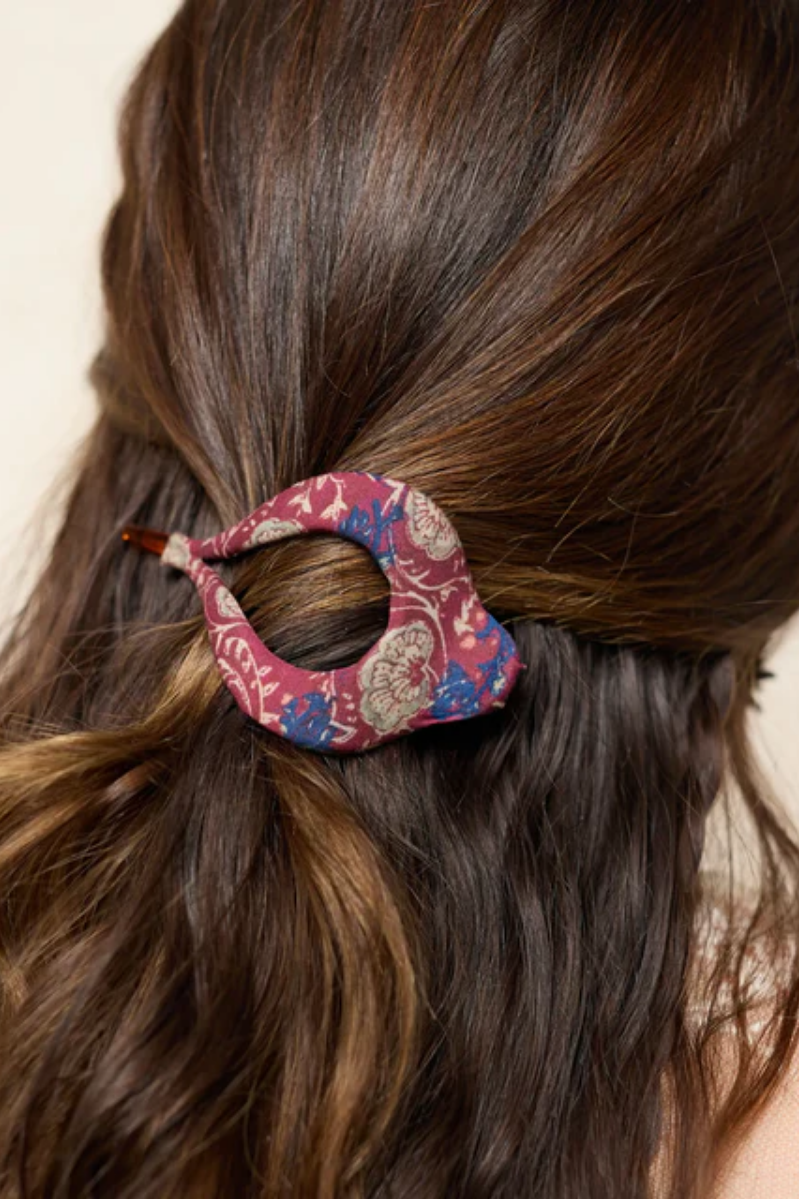 Close-up of a person's hair with a decorative hair clip.