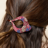 Close-up of a person's hair with a decorative hair clip.