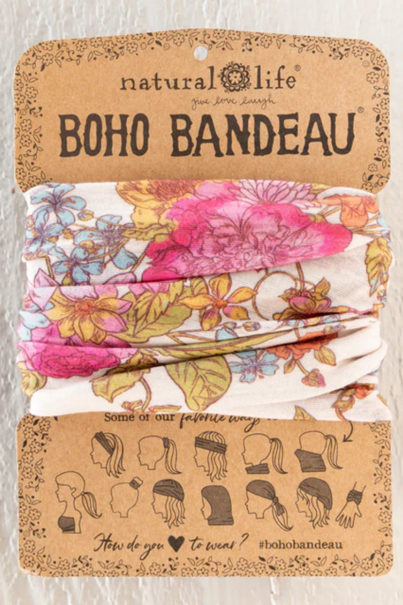 Floral boho bandeau with 'natural life' branding on a cardboard backing.