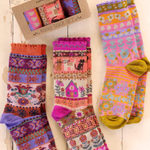 Colorful patterned socks with a box on a wooden surface. Cat Sock Set of 3.