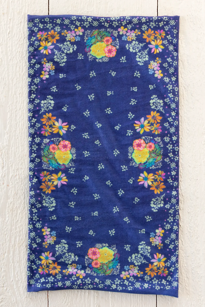 Floral-patterned towel on a wooden surface