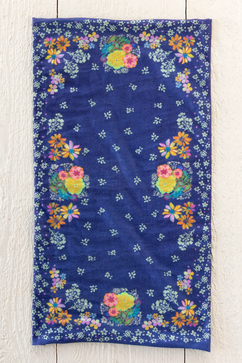 Floral-patterned towel on a wooden surface