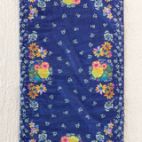 Floral-patterned towel on a wooden surface
