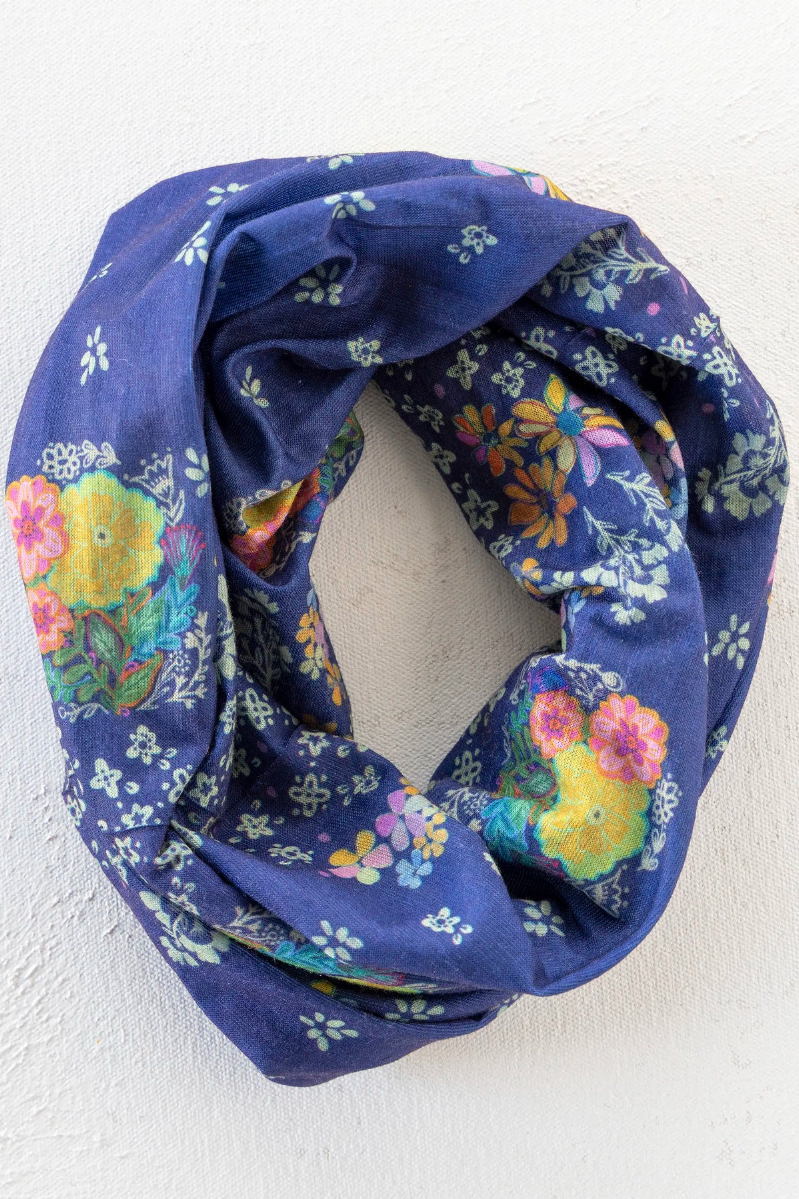 Navy blue floral patterned infinity scarf on a white background