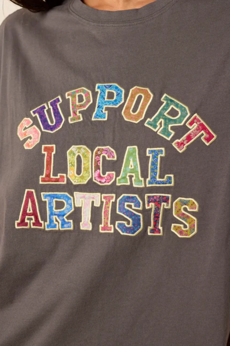 Gray sweatshirt with 'Support Local Artists' text in colorful letters.