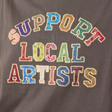 Gray sweatshirt with 'Support Local Artists' text in colorful letters.