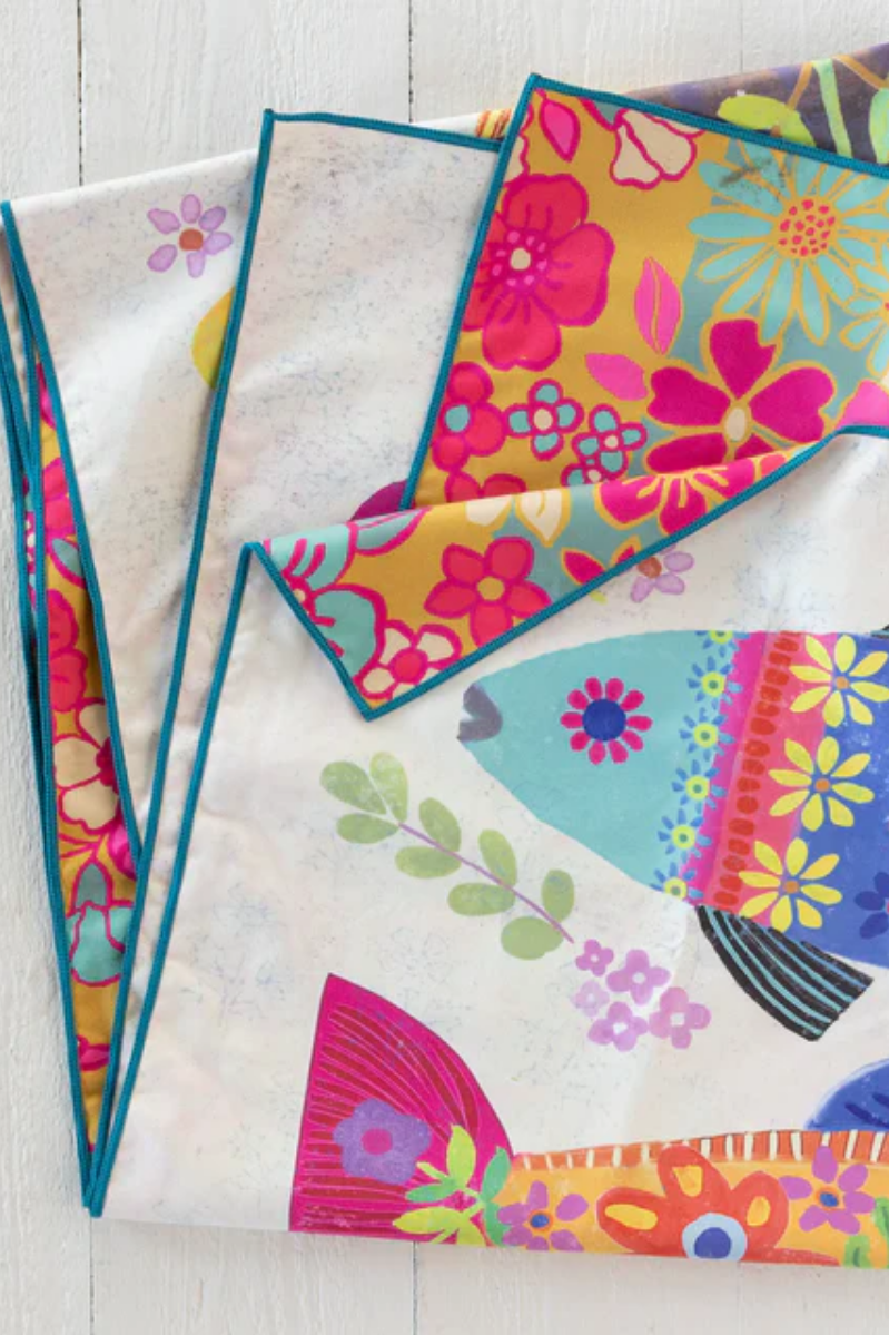 Colorful fabric with floral patterns on a white surface