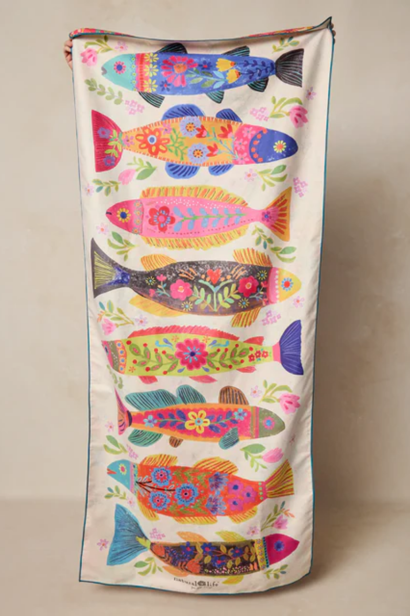Colorful fish-patterned bag on a beige background