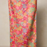 Colorful floral patterned fabric on a beige background